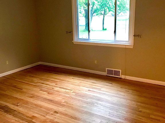 Professionally refinished solid oak hardwood flooring in living room