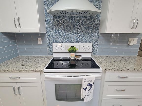 newly remodeled kitchen, bright and roomy in soothing colors of the sea