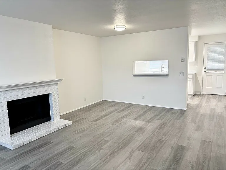 Explore this sleek open-concept living area, perfect for modern lifestyles.