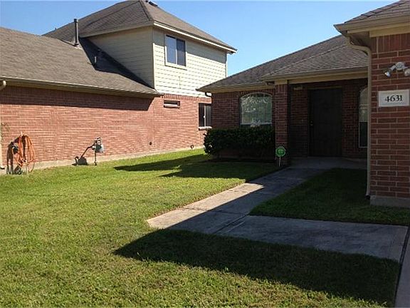 Side yard view from the driveway between neighbor.