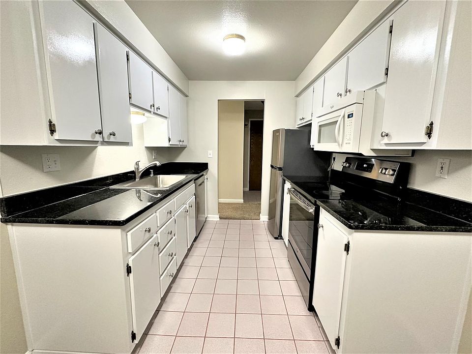 Kitchen with new granite countertop and stainless-steel appliances
