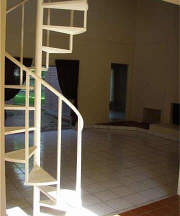 Great spiral staircase leading to loft area