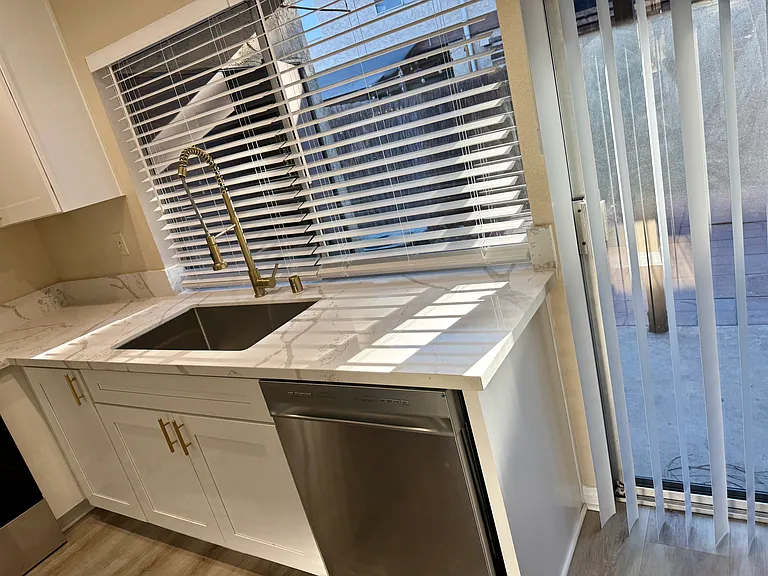 New sink, disposal, dishwasher. New window blinds. Sliding door to private patio