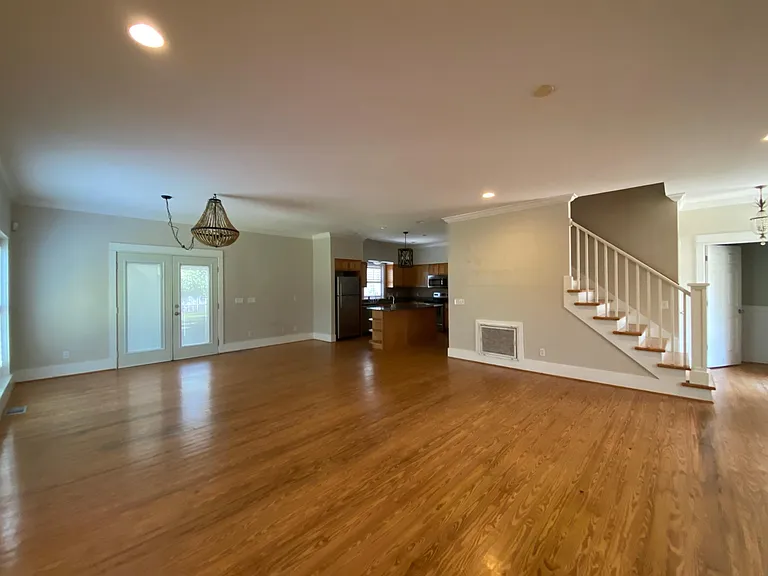 Downstairs living area. Hardwood floors throughout.