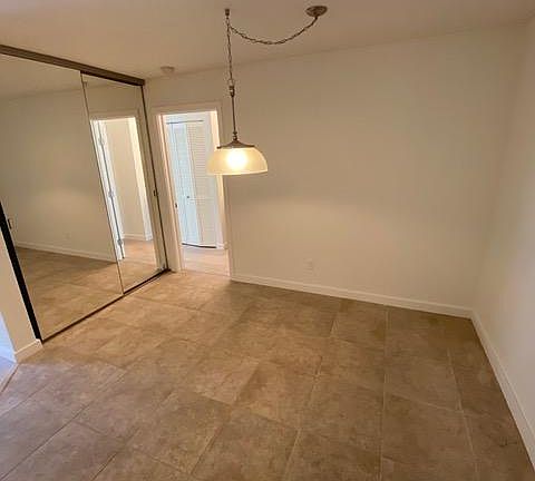 Dining Room with Beautiful Tile Flooring and Additional Storage/Closet