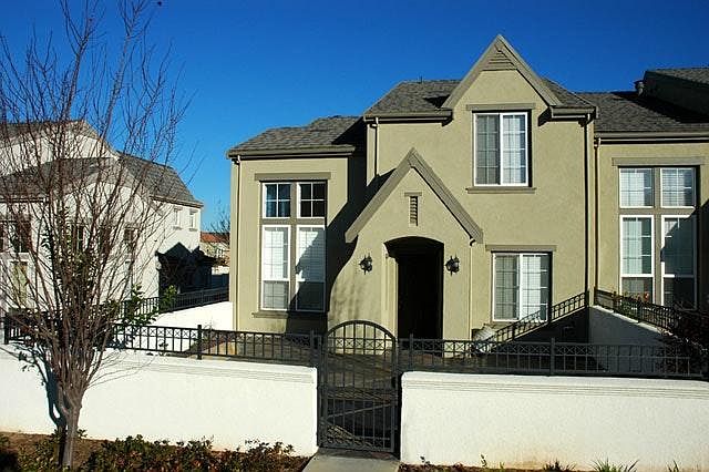 Front of property, showing gated private courtyard