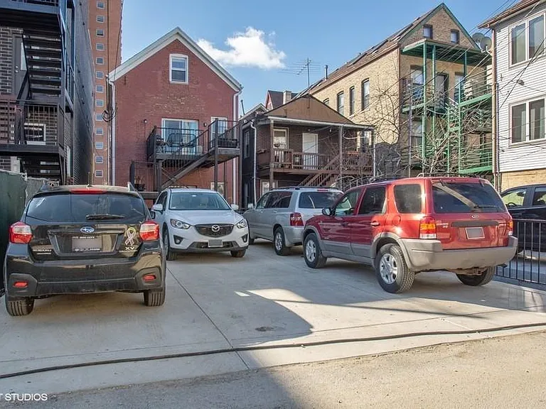 Parking pad with optional dedicated tandem spot which fits 2 cars