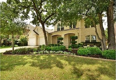 Located on a .23 acre greenbelt lot with beautiful oaks!