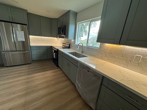 Brand new kitchen and appliances, including dish washer. Under cabinet lighting shown.