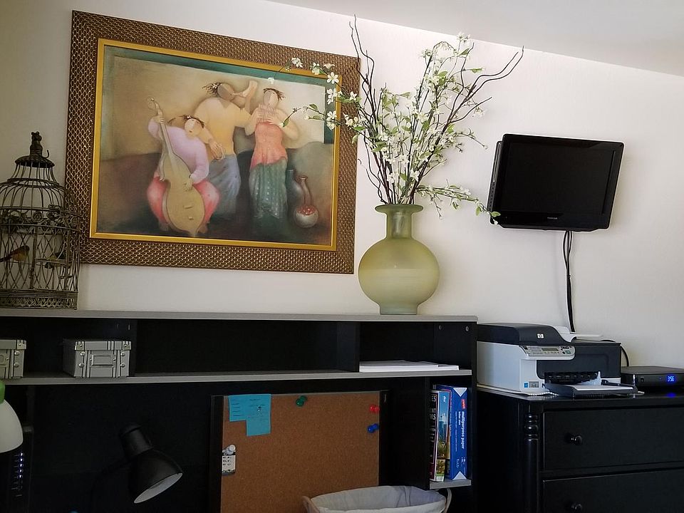 Office desk and printer set up in second bedroom, TV is now larger than pictured