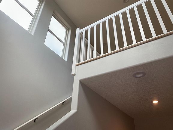 Entry stairs leading to living area and kitchen