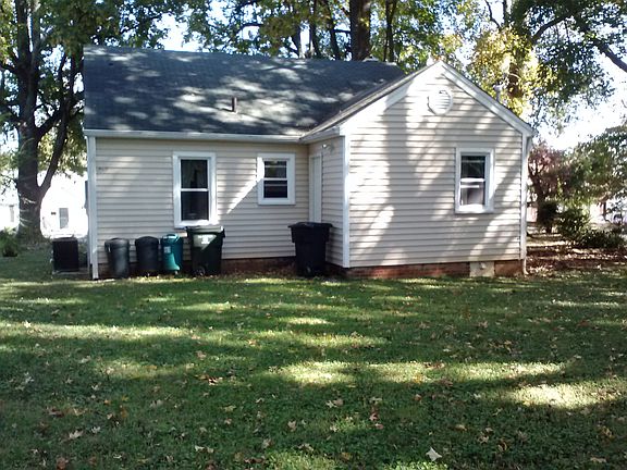 back of house with nice yard