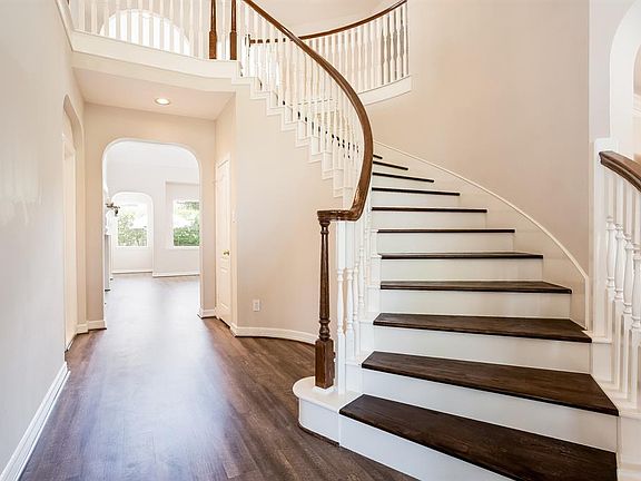 Sweeping Wood Stairs to Upper Landing