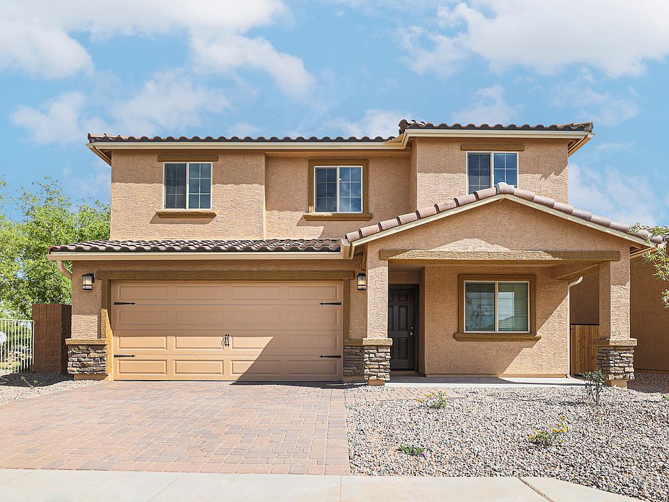 Exterior of the two-story Cimarron with a covered front porch and two-car garage.