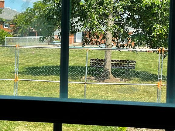 LOOKING OUT LIVING/DINING ROOM THROUGH ALL NEW WINDOWS.