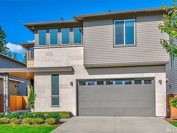 Lovely landscaping surrounds this home on quiet street.