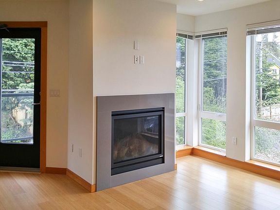 Gas fireplace and floor to ceiling windows