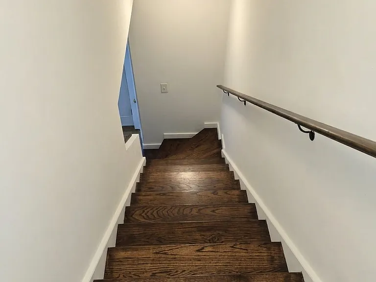 Stairs leading up to 2 bedrooms and 1 full bath