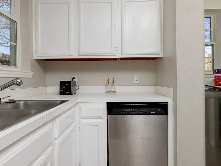 Fully stocked kitchen with ample counter space, stainless steel appliances, toaster, and kettle_everything you need to cook, snack, or sip in comfort.