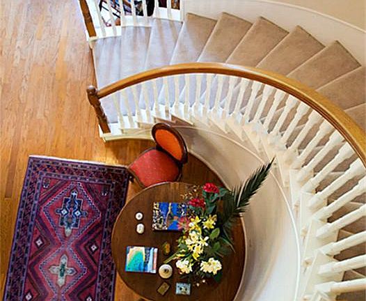 A view of the Entry and Stairway from the Balcony Above