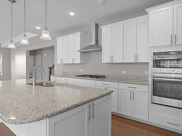 Stunning kitchen with stainless steel appliances, granite counters, and open concept