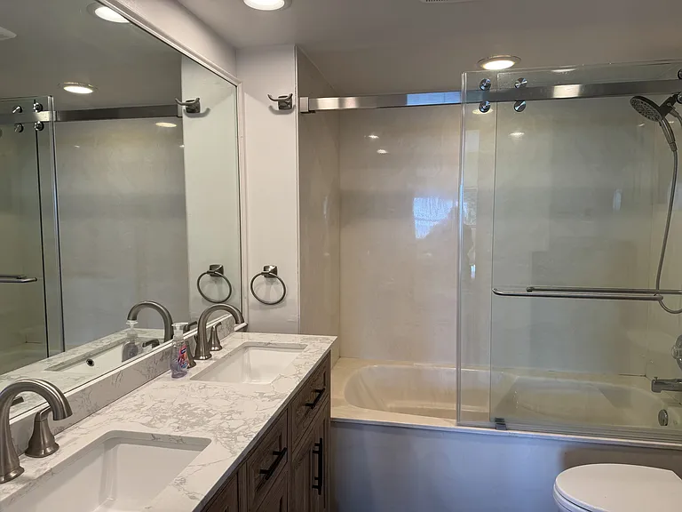 Master bathroom with double sinks and soaking tub.