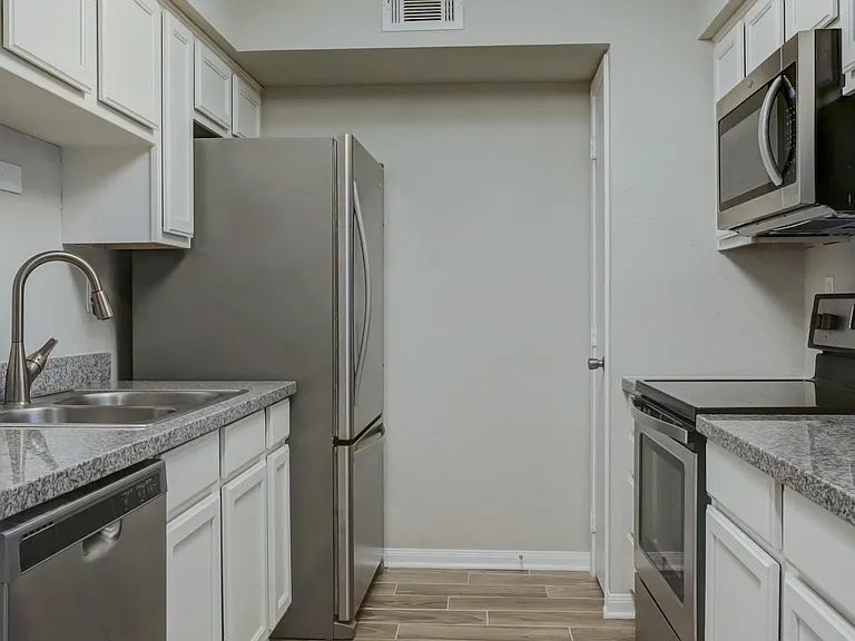 Kitchen w/all stainless steel appliances.