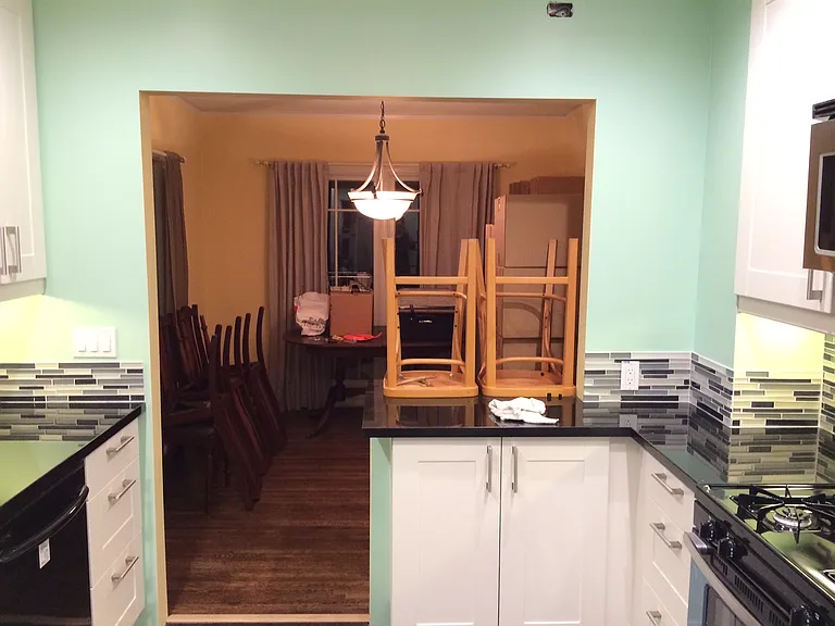 Kitchen leading to dining room (walls are now white)