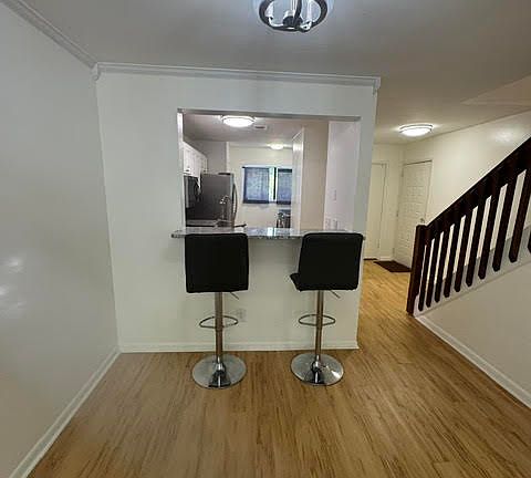 dining room area looking into kitchen and entry way