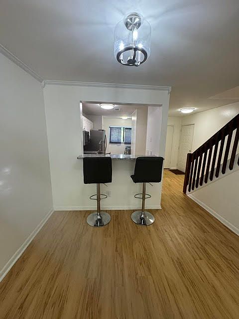 dining room area looking into kitchen and entry way