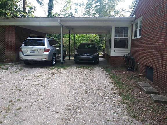 Carport with storage room on the end