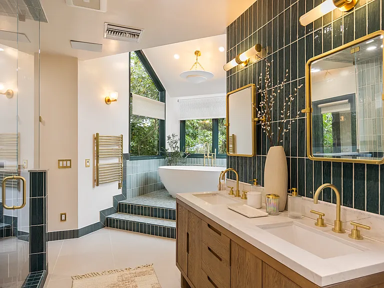Elegant double vanity and spacious shower in the completely renovated master bath.