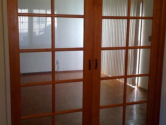 The Bonus room that shows sliding door to backyard.