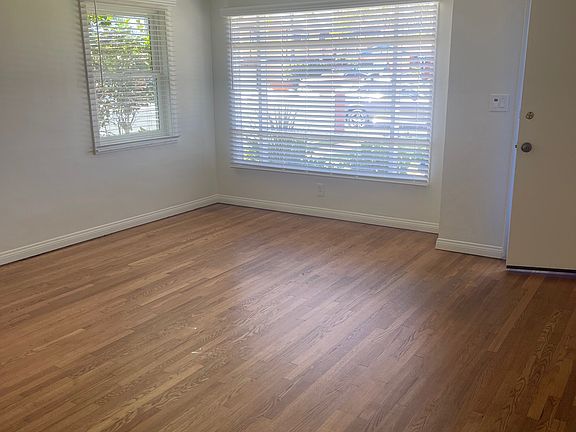 Living Room with front door slightly open.
