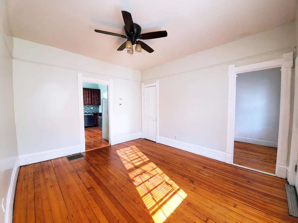 Living room towards kitchen. Office on the right - 3109 N Bernard St #1R