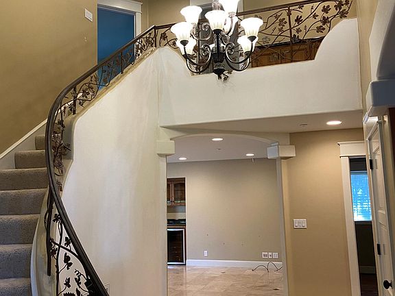 Grand entry stairway and breezeway between master and kids bedrooms.