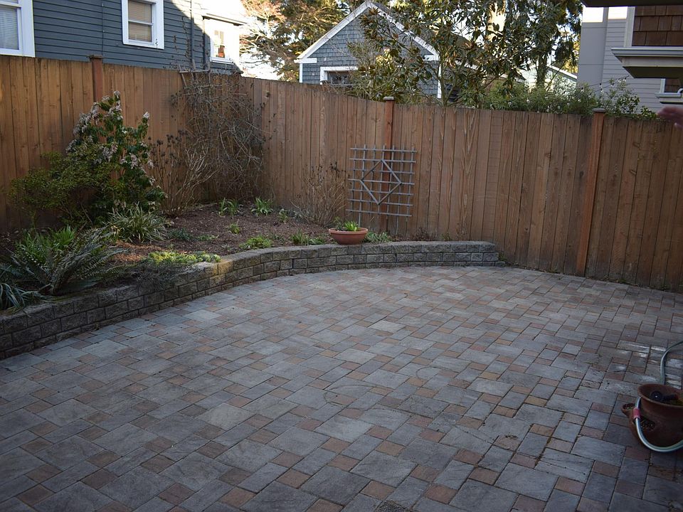 Fenced backyard with large patio