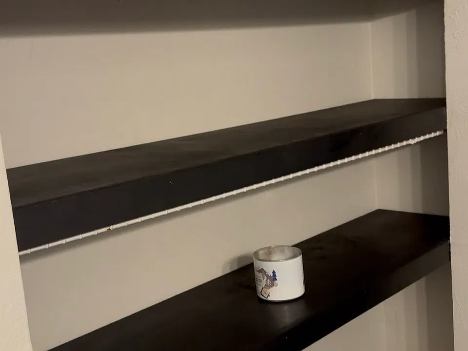 Additional shelving in bathroom for linens and extra storage