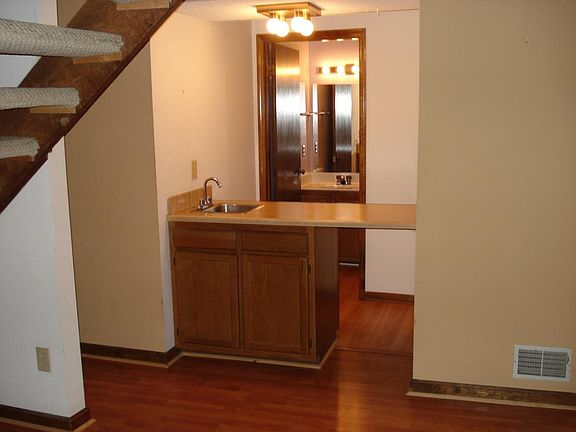 wet bar with 1/2 bath behind