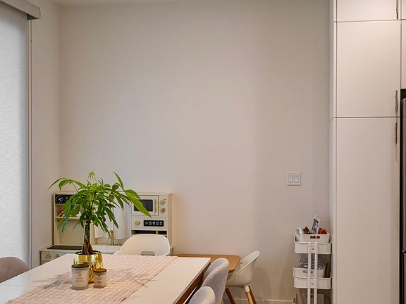 Bright & Airy Dining Space: Large dining area right next to the pantry cabinet. Features full-length sliding glass doors that flood the room with natural light and open directly to your private patio for seamless entertaining!