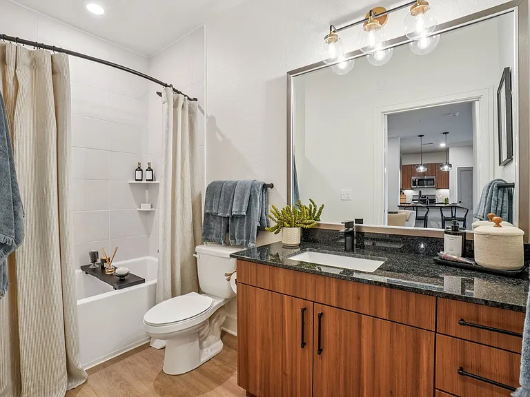 Bathroom with Granite Countertop and Soaking Tub