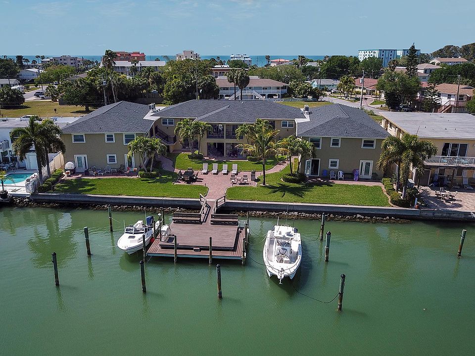 Courtyard, common waterfront patio, dock and boat slips are available for resdient use