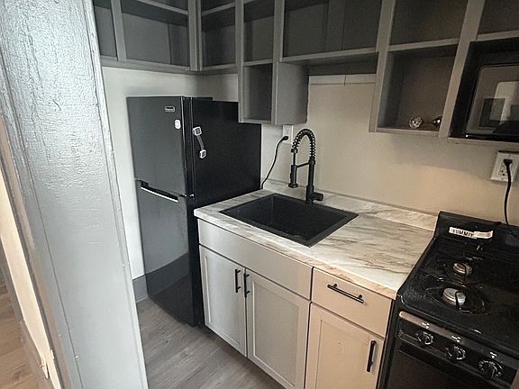 Kitchen with all updated appliances and sink.