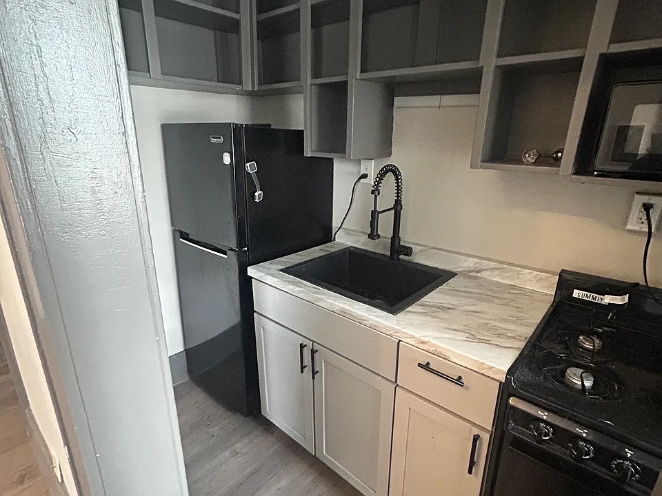 Kitchen with all updated appliances and sink.