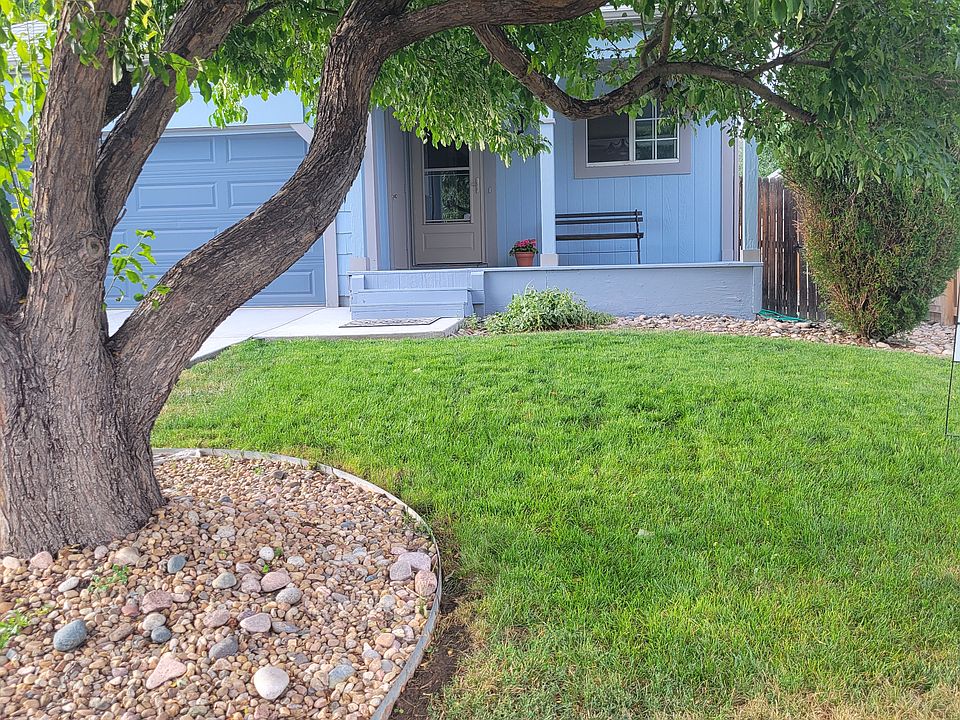 Mature shading tree in front yard, landscaped yard, sprinkler system, quiet front porch, two car garage