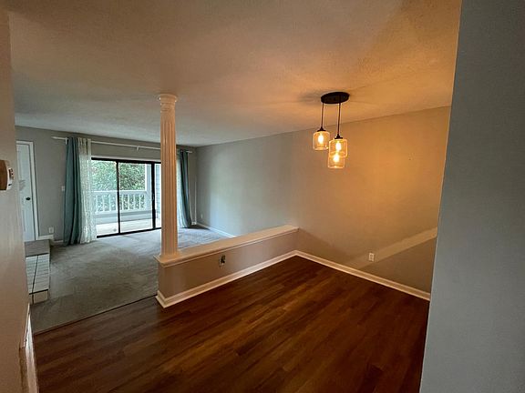 Photo taken from entryway, open concept living and dining room