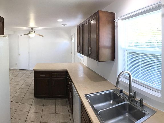 Kitchen - Modern fixtures, Refurbished cabinets, Side-by-side refrigerator, Dishwasher, Easy-lift Cordless blinds