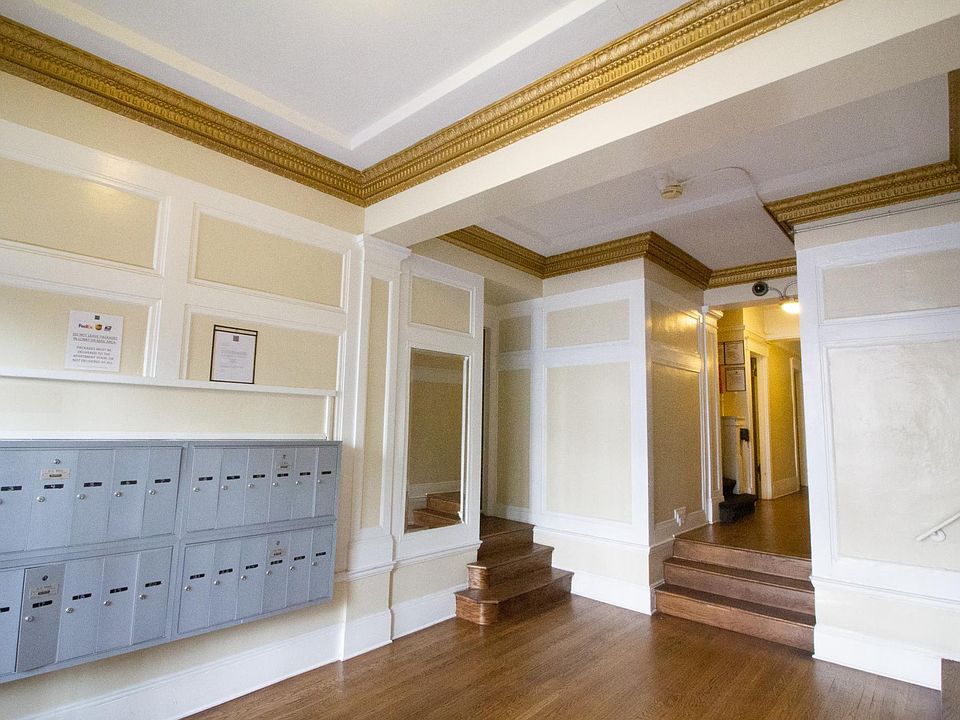 Apartment foyer with stylish decor and mailboxes