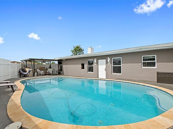 Saltwater pool, full outdoor kitchen and pergola. 