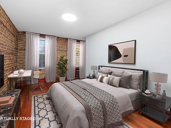 4th image of 150 E 3rd St APT 2E